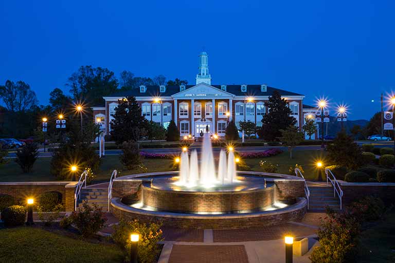A campus building at night